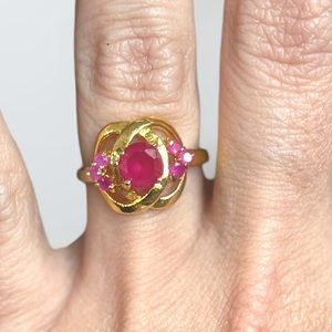 Gold tone and pink stone ring